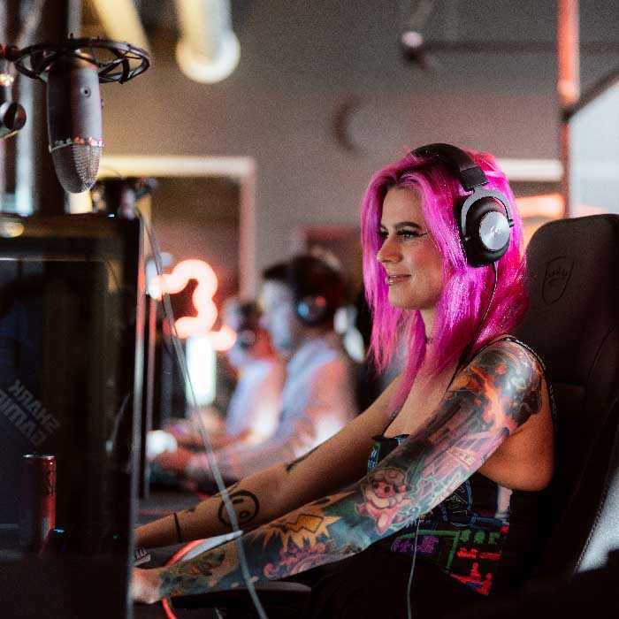 women with pink hair gaming
